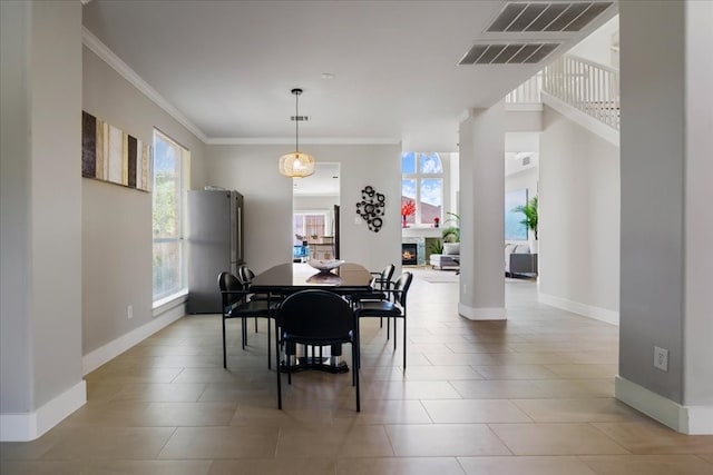 tiled dining room with ornamental molding