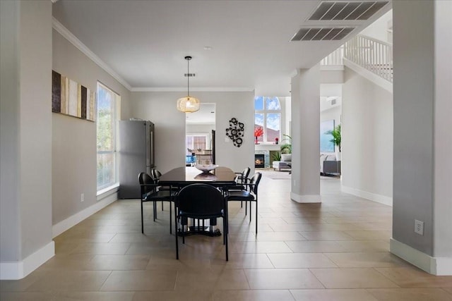 tiled dining room with crown molding