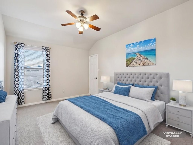 carpeted bedroom with lofted ceiling and ceiling fan