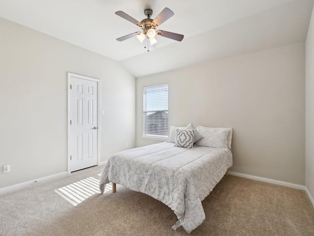 bedroom with lofted ceiling, light colored carpet, and ceiling fan