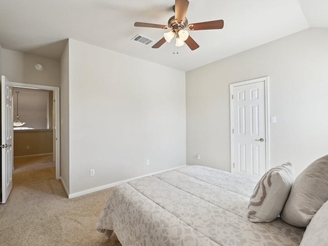 bedroom with light colored carpet, ceiling fan, and lofted ceiling