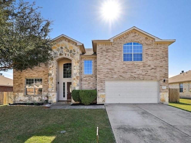 view of front of house featuring a front yard and a garage