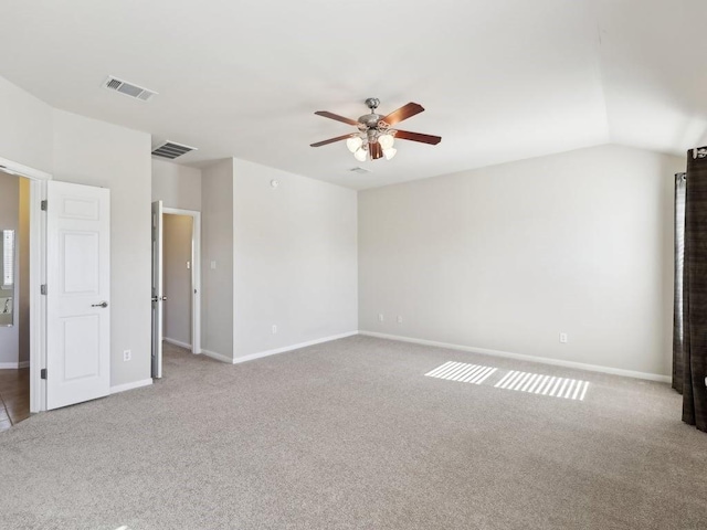 unfurnished bedroom featuring light carpet, ceiling fan, and lofted ceiling