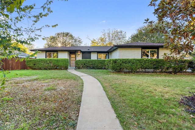 ranch-style house with a front yard