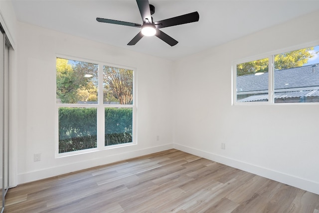 unfurnished room featuring light hardwood / wood-style flooring, a wealth of natural light, and ceiling fan