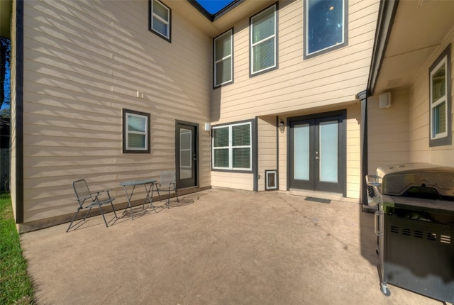 back of house with french doors and a patio area