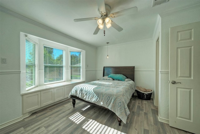 bedroom with multiple windows, ceiling fan, crown molding, and light wood-type flooring