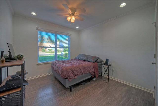 bedroom featuring ceiling fan, dark hardwood / wood-style flooring, and ornamental molding