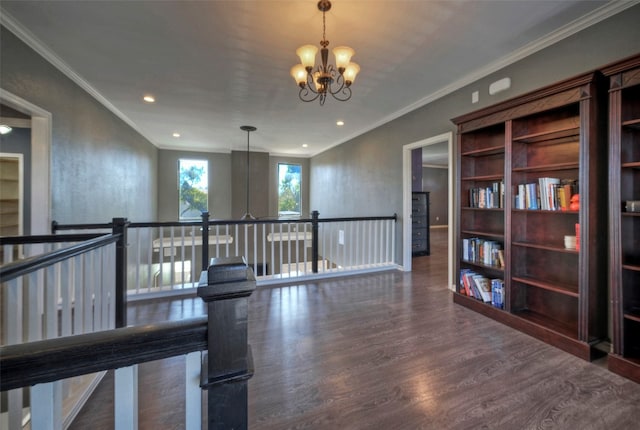 interior space with dark hardwood / wood-style flooring, crown molding, and an inviting chandelier