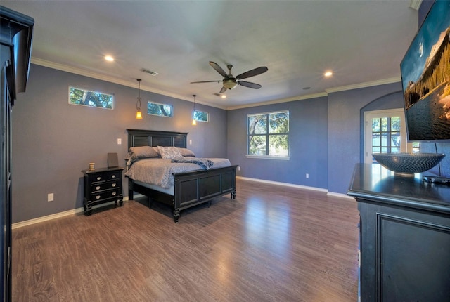 bedroom featuring ceiling fan, crown molding, and dark wood-type flooring