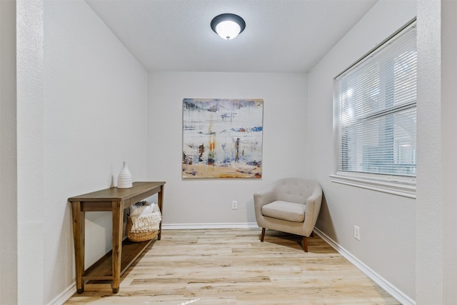 living area with wood-type flooring