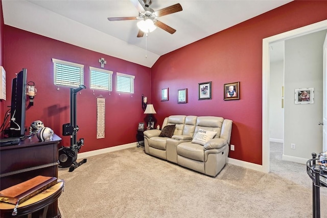 interior space with ceiling fan, carpet, and vaulted ceiling