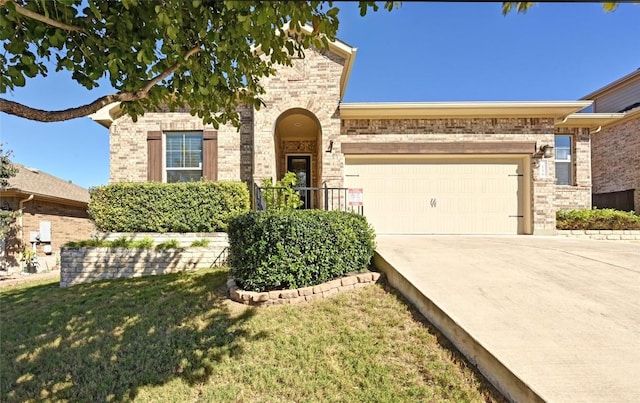 view of front of home featuring a front yard and a garage