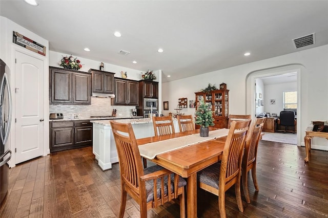 dining room with dark hardwood / wood-style flooring