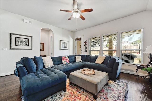 living room with ceiling fan, dark wood-type flooring, and lofted ceiling