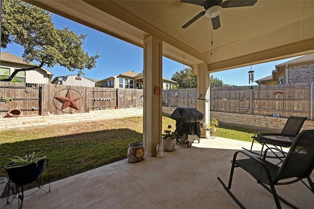 view of patio / terrace with ceiling fan and area for grilling