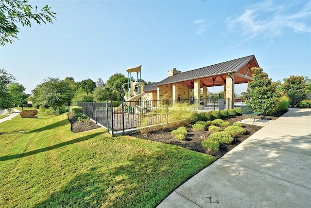 view of community with a playground and a yard