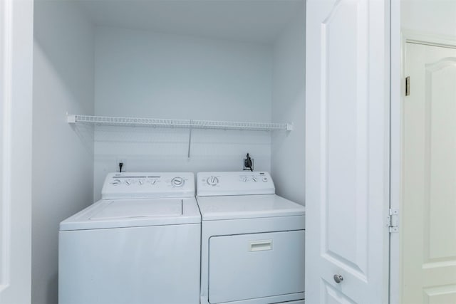 laundry room with washing machine and dryer