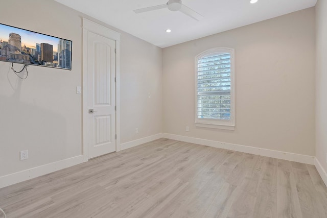 empty room featuring recessed lighting, a ceiling fan, baseboards, and wood finished floors