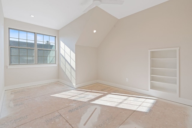 bonus room with ceiling fan, vaulted ceiling, and built in features