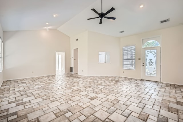 entryway featuring ceiling fan and high vaulted ceiling