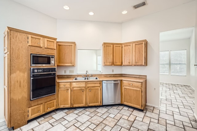 kitchen with sink and appliances with stainless steel finishes