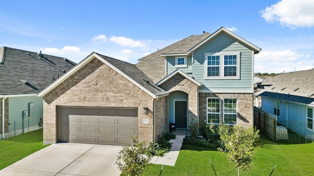 view of front of house with a garage and a front lawn