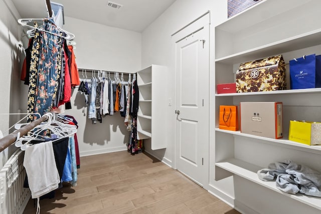 walk in closet featuring hardwood / wood-style floors