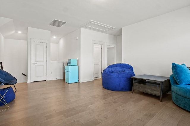 living area with light hardwood / wood-style floors