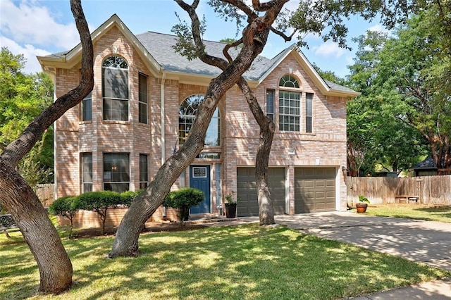 front facade with a front yard and a garage