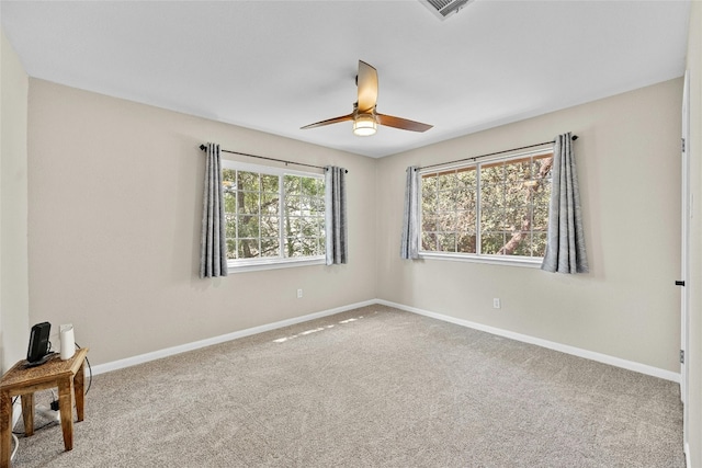 empty room with carpet and ceiling fan