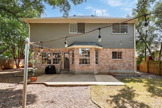 back of property featuring a patio area