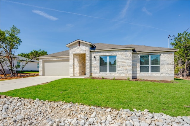 view of front of home with a garage and a front lawn