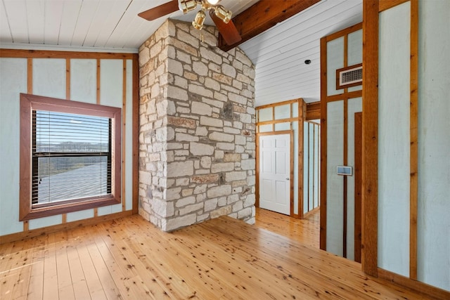 spare room with ceiling fan, beam ceiling, light wood-type flooring, and high vaulted ceiling