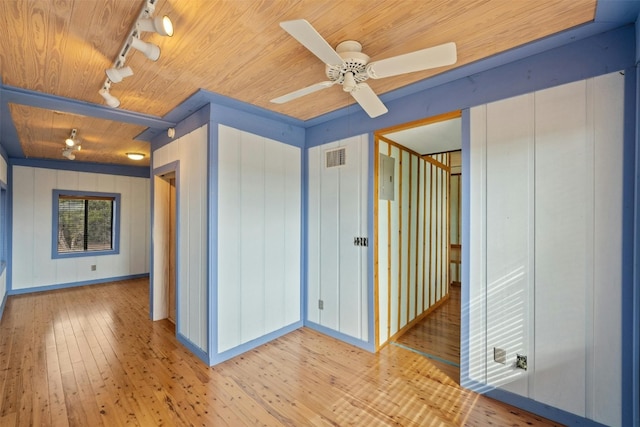 interior space with wooden ceiling, ceiling fan, light hardwood / wood-style floors, and track lighting