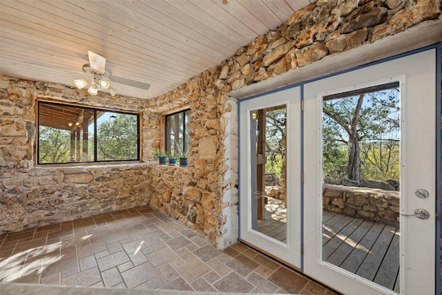 entryway with plenty of natural light, wooden ceiling, and ceiling fan