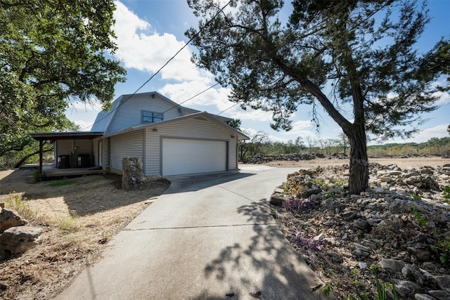 view of side of property with central AC