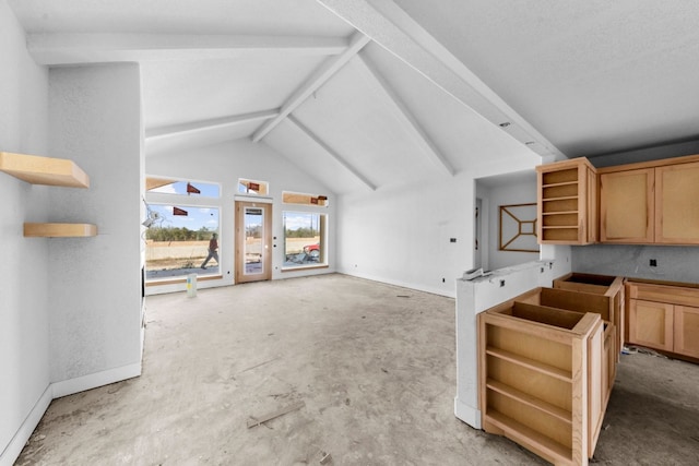 unfurnished living room featuring lofted ceiling with beams