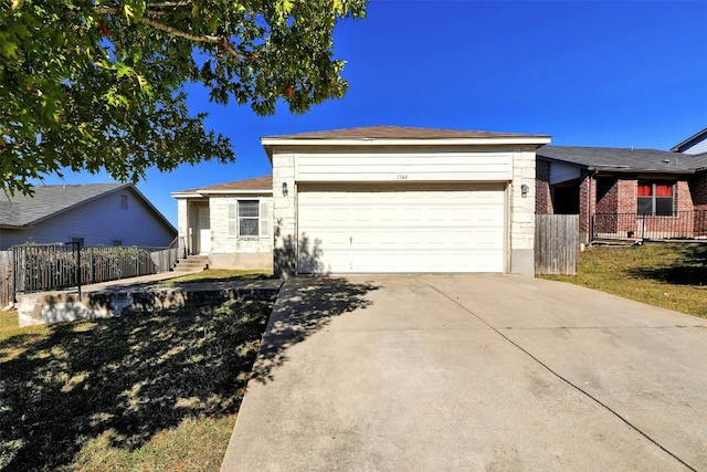 ranch-style house featuring a garage