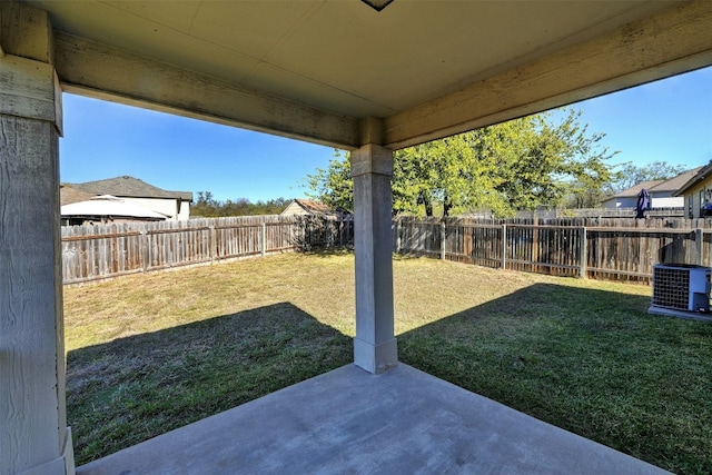 view of yard featuring a patio, central AC unit, and a fenced backyard