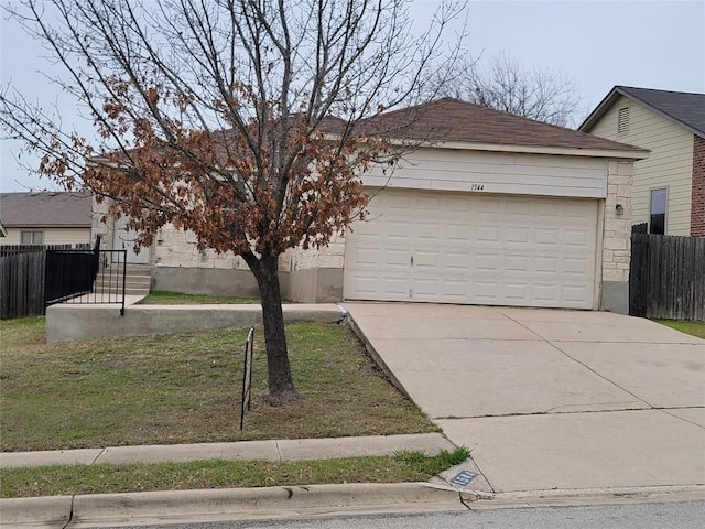 view of front of house with a garage, concrete driveway, stone siding, and fence