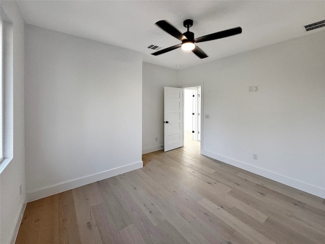 spare room with light hardwood / wood-style flooring