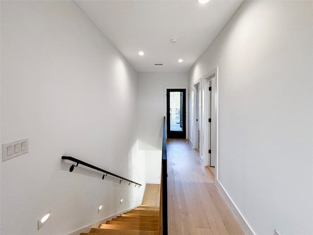 staircase featuring wood-type flooring