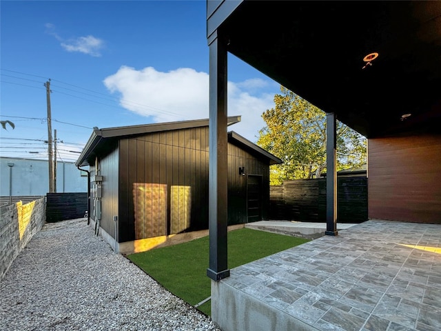 view of side of property featuring a patio area