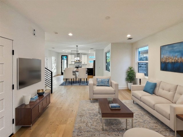 living room with light hardwood / wood-style flooring