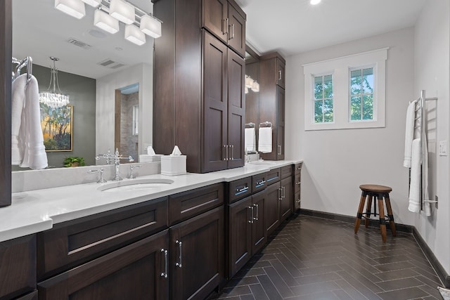 bathroom with vanity and parquet floors