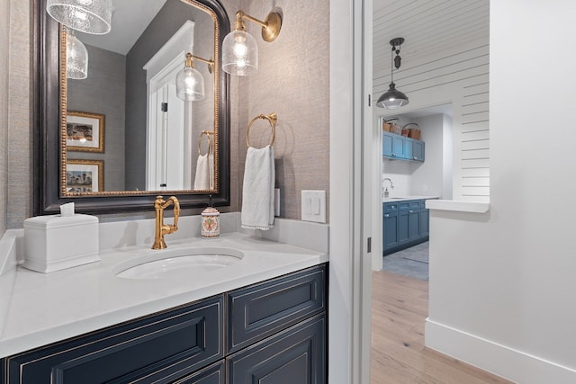 bathroom featuring vanity and wood-type flooring