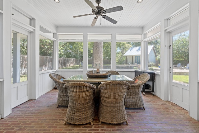 sunroom / solarium with wooden ceiling and ceiling fan