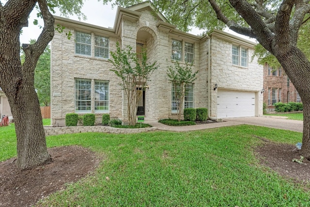 view of front of house with a garage and a front lawn