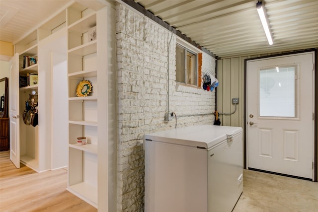 laundry area featuring light hardwood / wood-style flooring